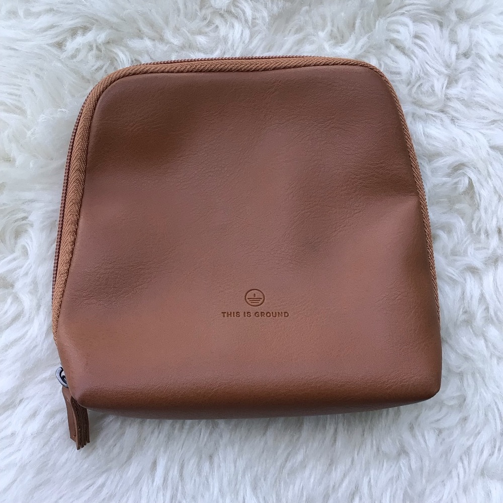 This is Ground Leather Zip Around Travel Pouch